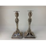 A pair of Victorian silver column candlesticks, makers Hawksworth, Eyre & Co, Sheffield 1890, with