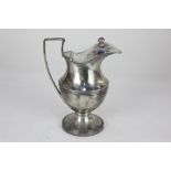 A 19th century Portuguese silver jug, baluster shape with hinged lid, 14.5oz 18cm high