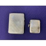 A George V silver cigarette case, makers Joseph Gloster Ltd, Birmingham 1935, together with a silver