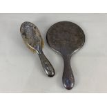 A silver backed hand mirror, maker William Adams Ltd, Birmingham 1939, together with a matched