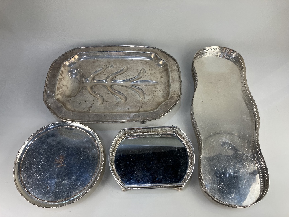 A silver plated meat tray, a silver plated salver with crest (worn plate), a silver plated long