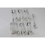 A set of six George V silver coffee spoons with shell terminals, maker Mappin and Webb London
