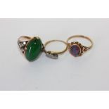 A jade and diamond ring, a black opal doublet ring and a crossover ring