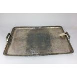 A large silver plated rectangular tray with bale handles and fluted bouge, 72cm by 53cm