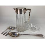 A Mappin & Webb silver plate mounted cut glass water jug, an Elkington & Co silver plated basting