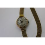 Rolex. A lady's 18ct gold bracelet watch, octagonal case with Prima movement on a mesh bracelet with