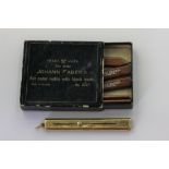 An 18ct gold slide pencil by Sampson Mordan 9.1g gross, with a box of refills