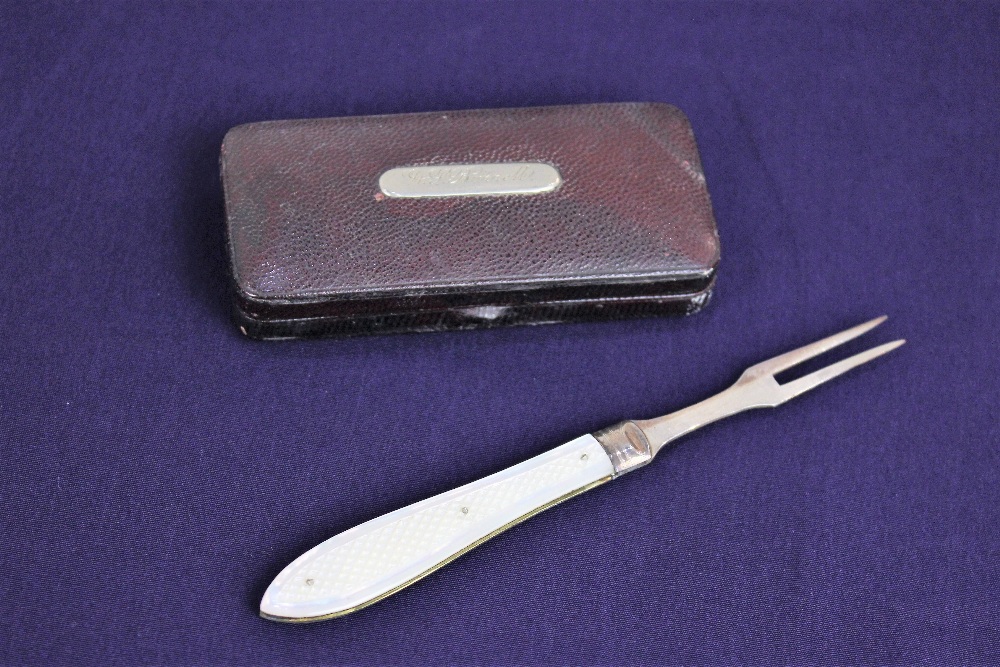 A Victorian silver folding travel fork with mother of pearl handle, in red leather box with name