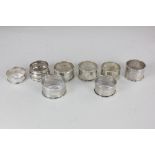 Seven various silver napkin rings, and another a/f (with tears) 3.5oz