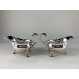 A pair of George V silver sauce boats, makers William Comyns & Sons Ltd, London 1931, with scroll