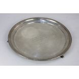 A George V silver salver on three paw feet, with presentation engraving to centre, maker Joseph