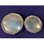 A graduated pair of George V silver salvers, makers Harrison Brothers & Howson, Sheffield 1928, of