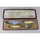 A cased pair of Victorian silver fish servers, makers James Dixon & Sons Ltd, London 1896, with