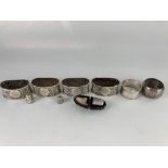 A set of four Victorian silver napkin rings, maker William Richard Corke, London 1898, with embossed