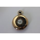 A Swiss 14ct gold half hunter cased pocket watch, unsigned dial and movement