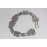 A late Victorian silver belt pieced scrolled panels with chain links, maker SJ London 1898, 8.3oz