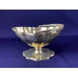 An Edward VII silver sugar basket, makers R & S Garrard & Co, London 1907, of scalloped form with