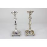 A pair of Portuguese silver table candlesticks square bases on ball feet with faceted baluster