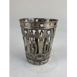 A Portuguese white metal glass holder, with pierced design, 11cm high