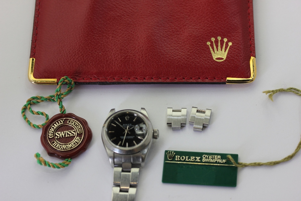 Rolex. A lady's steel bracelet watch, oyster perpetual date range black dial, oyster bracelet with