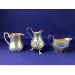 A Victorian silver cream jug, maker John Millward Banks, Birmingham 1897, of half reeded form, a