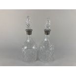 A pair of Elizabeth II silver mounted cut glass decanters, makers Mappin & Webb, Birmingham 1963,