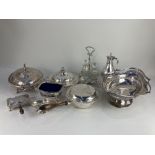 A silver plated muffin dish, a warming entree dish and cover, a cake basket, a cruet set in stand, a