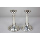 A pair of Elizabeth II silver dwarf candlesticks, maker John Bull Ltd, Birmingham 2000, of plain