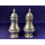 A pair of Victorian silver muffineers, makers William Gibson & John Lawrence Langman of Goldsmiths &