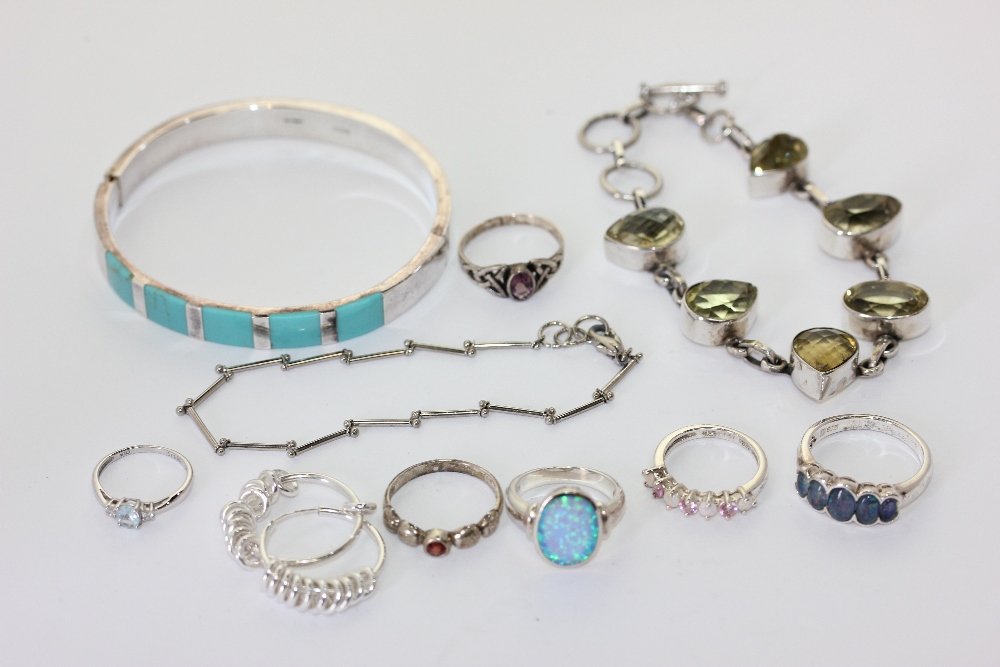 A group of silver jewellery and a base metal bracelet