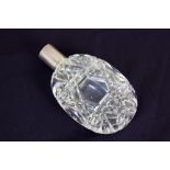 A Mappin & Webb silver mounted cut glass oval scent bottle, London 1927, missing stopper