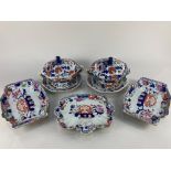 A pair of 19th century Imari pattern stoneware sauce tureens, covers and saucers, with fo dog