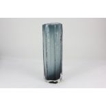 A Whitefriars style glass vase, of tall ribbed form, in smoky grey cased in clear glass, 30cm high