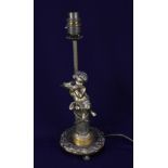 A Spanish brass figural table lamp, modelled as a cherub playing a pipe seated on a column, 33cm