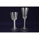 Two 18th century drinking glasses, comprising a wine glass, with cup shaped bowl on a double