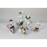 A Sitzendorf porcelain pair of figures, a lady holding a tambourine, 20cm, a gentleman with arm