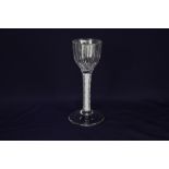 An 18th century wine glass, ribbed ogee bowl, with double series opaque white twist stem to plain