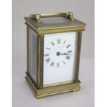 A brass carriage clock, with Roman numerals, marked Mappin and Webb, 15cm