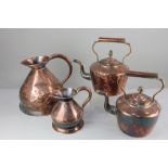 A collection of copper ware, comprising two kettles and two jugs