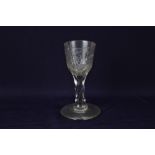 An 18th century wine glass, ovoid bowl with Jacobite style engraving of a rose and leaf sprays,