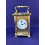 A French brass carriage clock white dial with Roman numerals marked Bayard, 8 day, 14cm high
