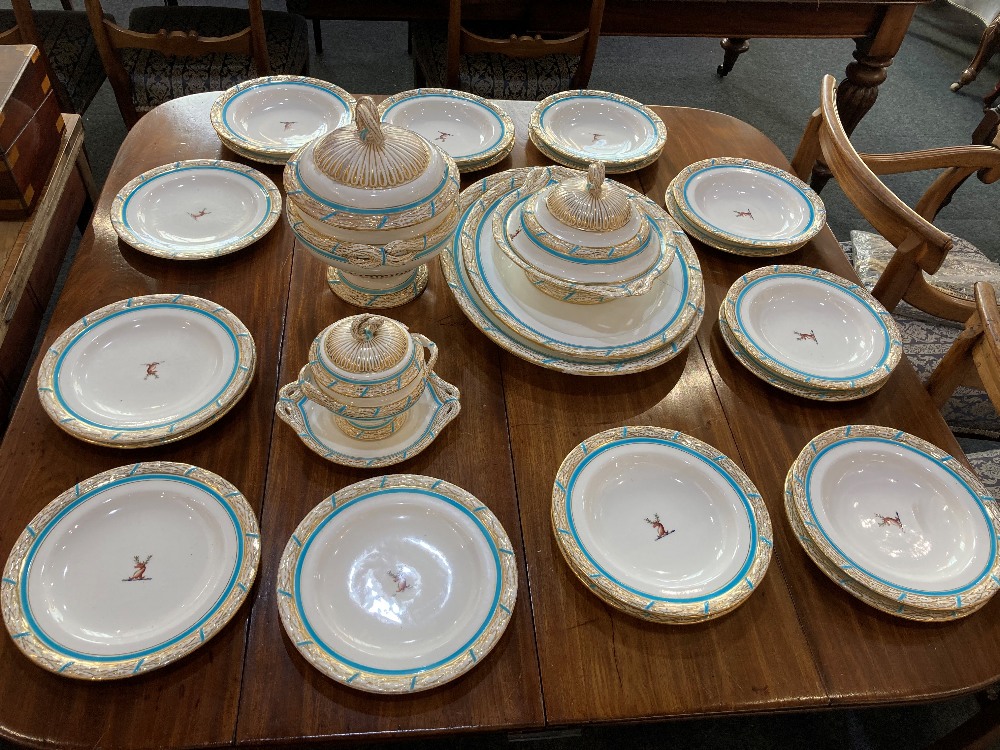 A 19th century Royal Worcester part dinner service, decorated with deer crest and turquoise and gilt