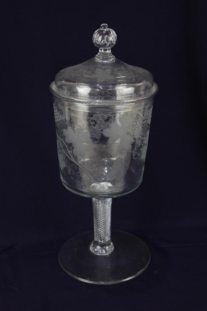 A 19th century glass vase and cover, with air twist stem, etched grape and vine decoration,39cm