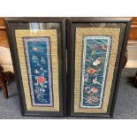 A pair of framed Chinese needlework pictures, depicting flowers and birds, 59.5cm by 24.5cm