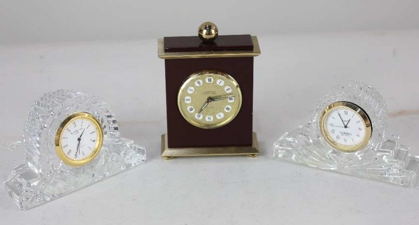 A Looping gilt metal mounted eight day travel clock, together with a Waterford crystal miniature