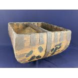 A metal bound wooden trug, with black painted character marks decorating exterior, 23.5cm high