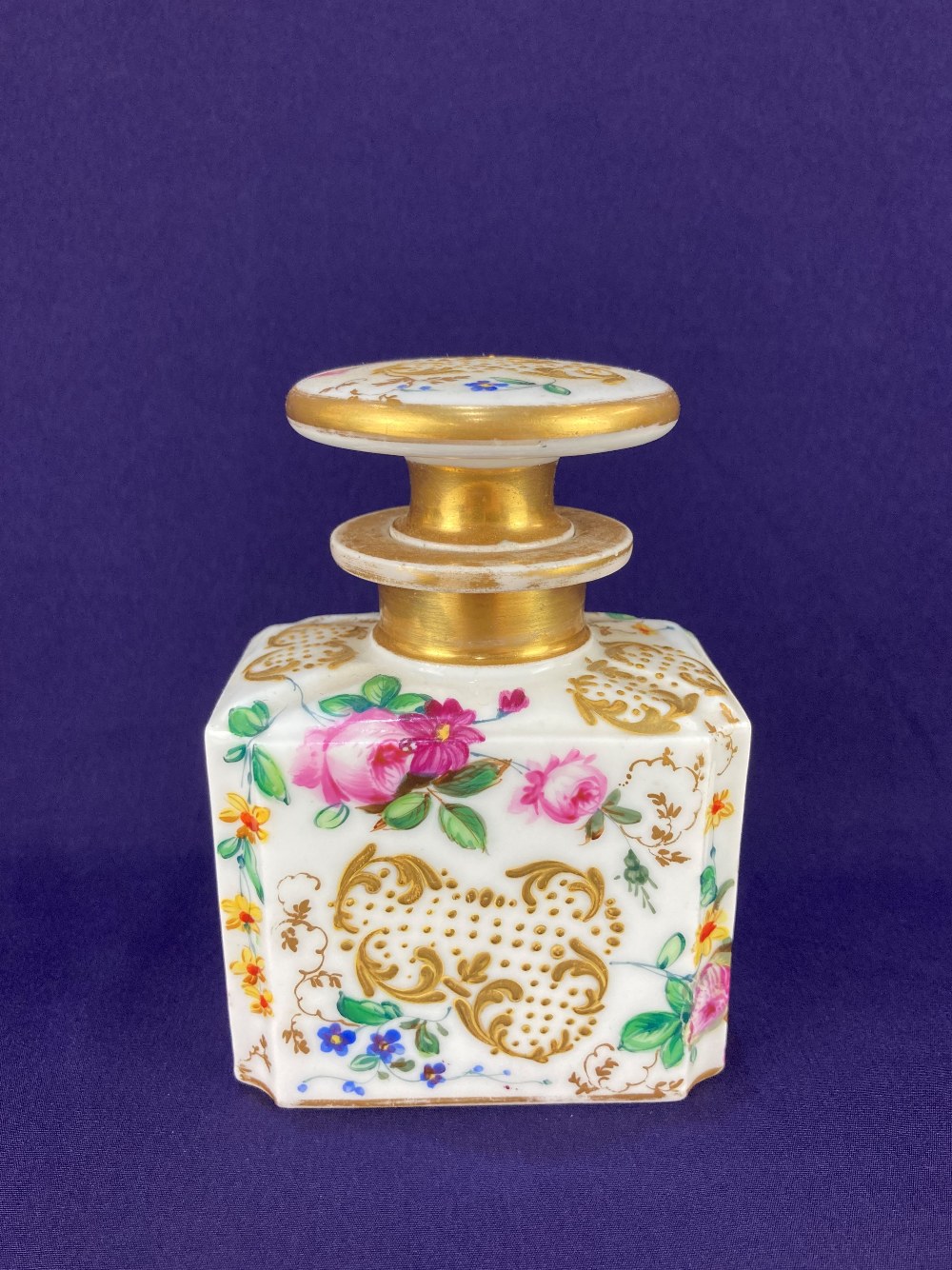 A 19th century Continental porcelain scent bottle, with hand painted floral sprays and gilt