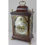 An 18th century mahogany cased bracket clock, the domed brass face with silverised dials, gilt