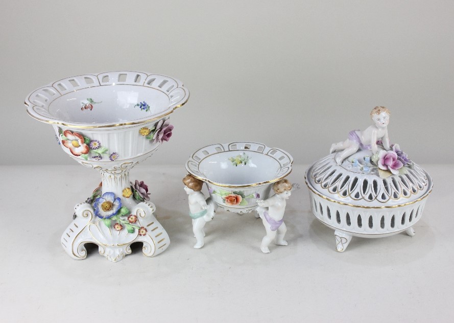 A German Schierholz porcelain centrepiece, encrusted with flowers, with gilt embellishments, on