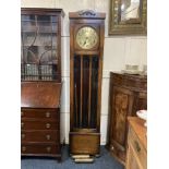 A 20th century oak longcase clock, the circular 10 1/2inch brass dial with Arabic numerals, the